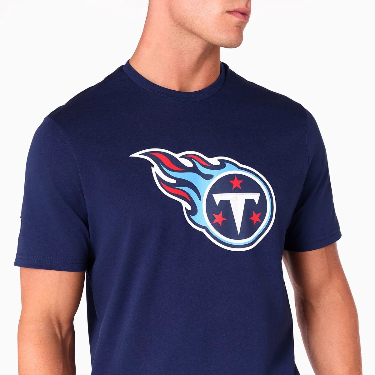 New Era Tennessee Titans NFL Navy T-Shirt, three-quarter view showing the large printed team logo with red stars and blue flame design on the chest, short sleeves and a round neckline.