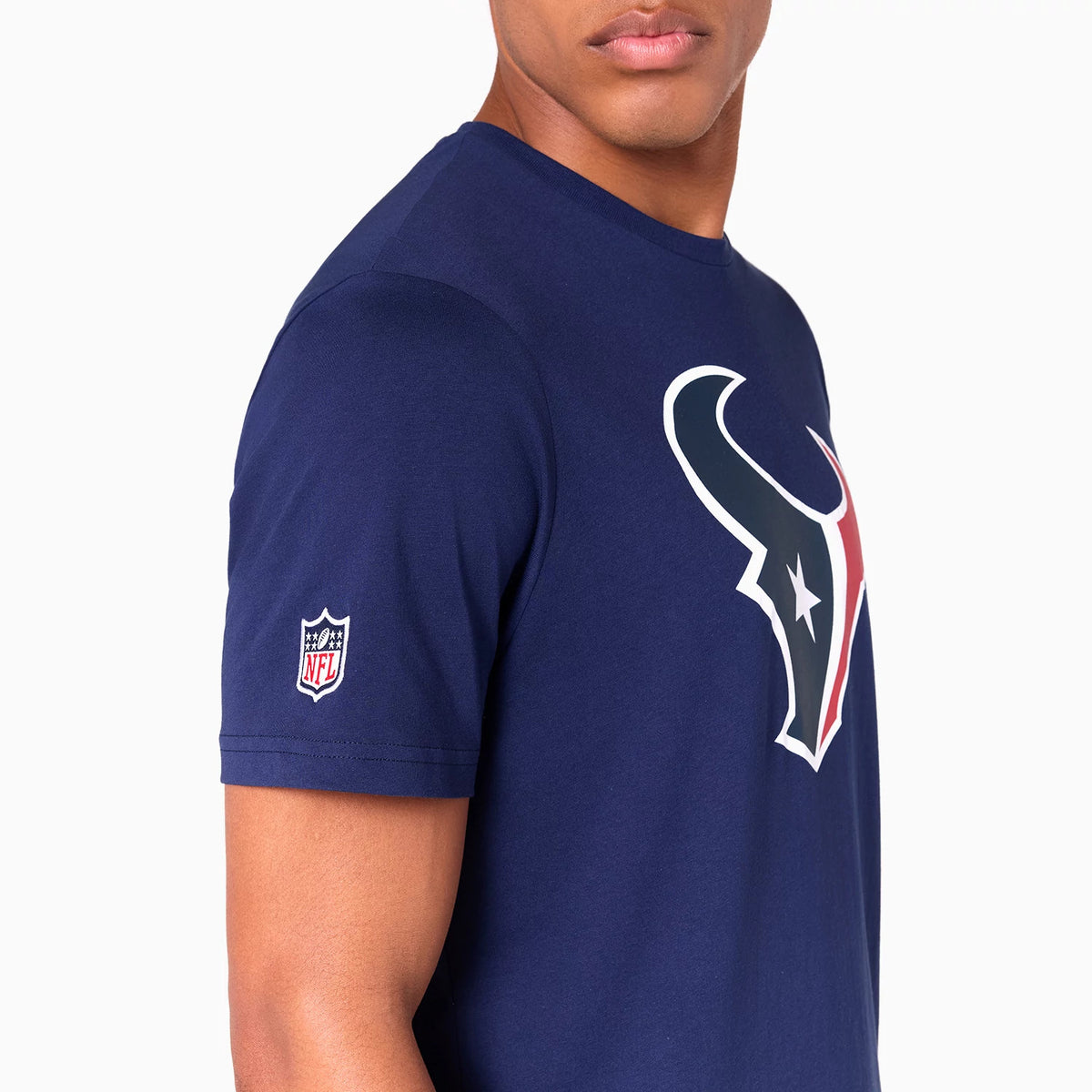 New Era Houston Texans NFL Navy T-Shirt, side view showing the large white and red team logo on the chest and the embroidered NFL shield logo on the left sleeve of the plain navy fabric.