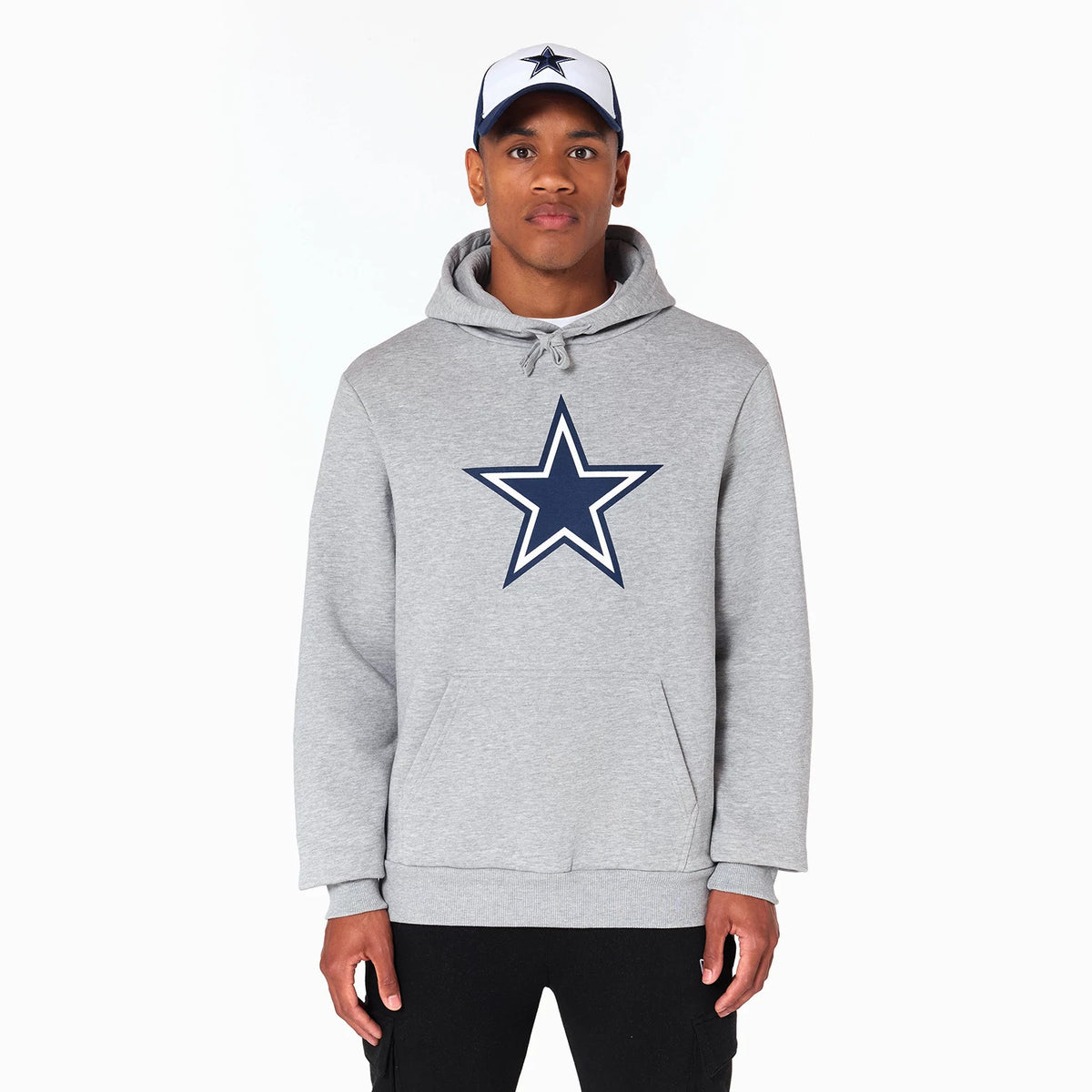New Era Dallas Cowboys NFL Grey Pullover Hoodie, front view showing a large navy star logo centred on the chest, a drawstring hood and long sleeves, worn by a person with a matching cap with a navy star on the front.