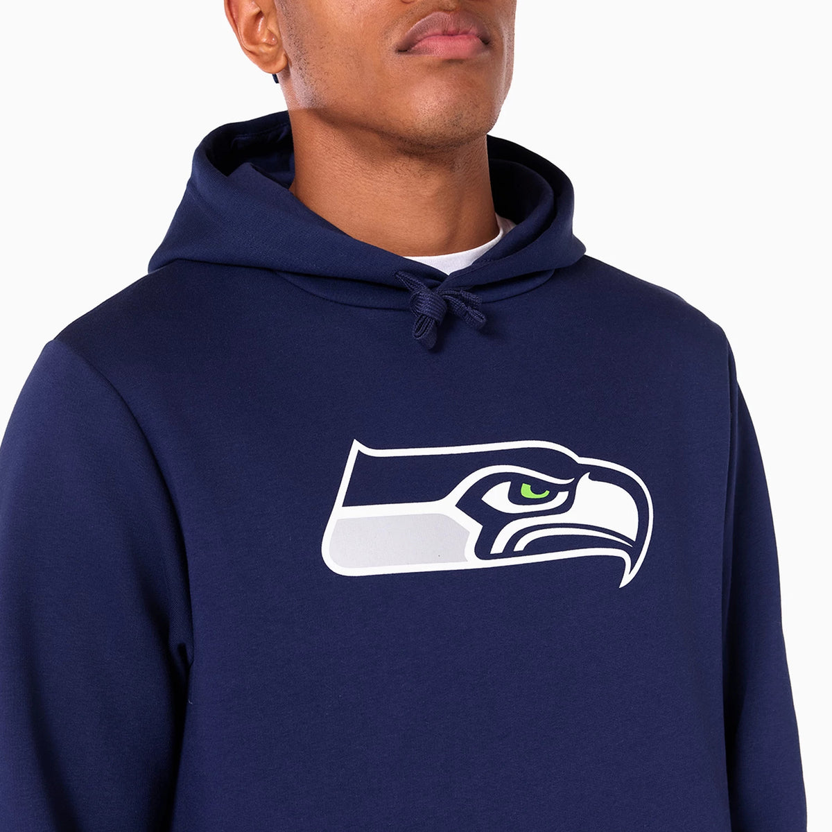 New Era Seattle Seahawks NFL Navy Pullover Hoodie, front view showing a navy fabric with a large printed Seahawks logo in the centre of the chest, featuring an eye-catching green eye, under a cleanly folded hood with drawstrings.