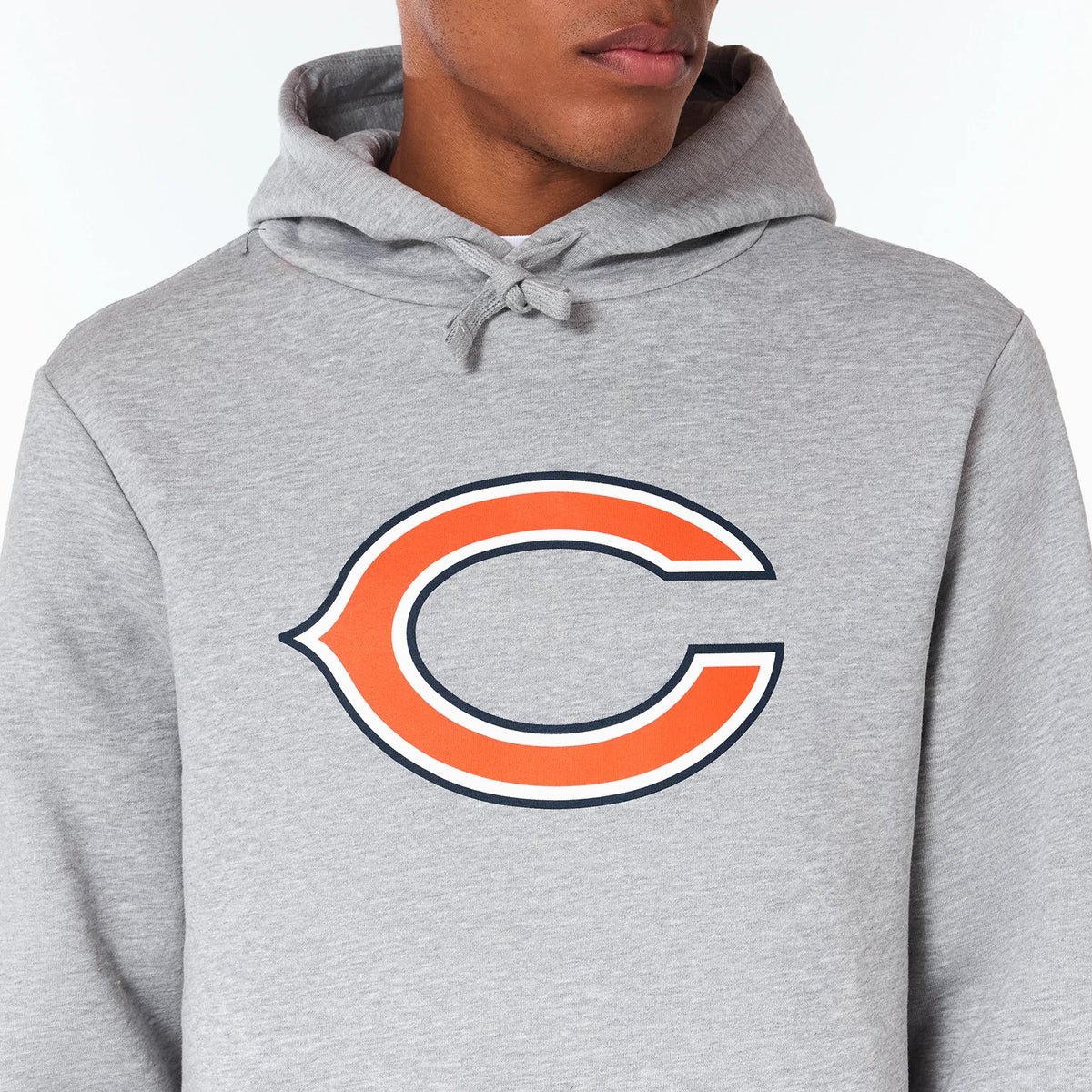 New Era Chicago Bears NFL Grey Pullover Hoodie, front view showing a grey hoodie with a large orange C logo outlined in navy screen printed on the chest and the hood with drawstrings draped around the neck.