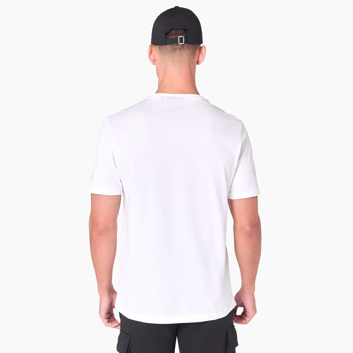 New Era Washington Commanders NFL White T-Shirt, rear view featuring a plain white back with short sleeves, worn by a model also wearing a black cap with a debossed New Era logo and an adjustable buckle at the back.