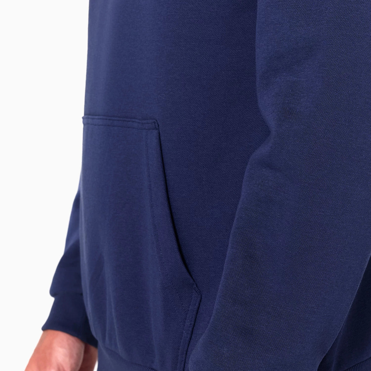 New Era Detroit Pistons NBA Navy Pullover Hoodie, side view showing the lower half with a kangaroo pocket on the left side, ribbed cuff on the sleeve, and no visible logo or additional features.