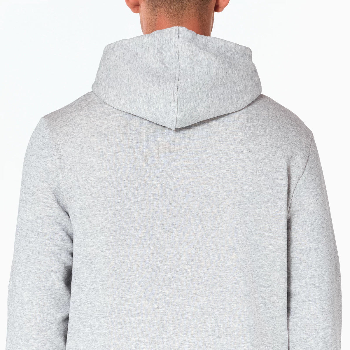 New Era Dallas Mavericks NBA Grey Pullover Hoodie, rear view showing the plain grey fabric with a hood resting on the upper back and shoulders, extending smoothly into long sleeves.