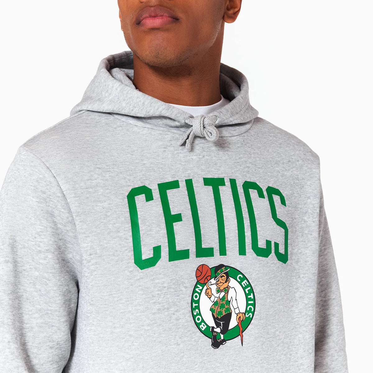 New Era Boston Celtics NBA Grey Pullover Hoodie, front view showing a light grey fabric with a large green CELTICS print across the chest, and the Boston Celtics logo centred below, the hood tied at the neck.