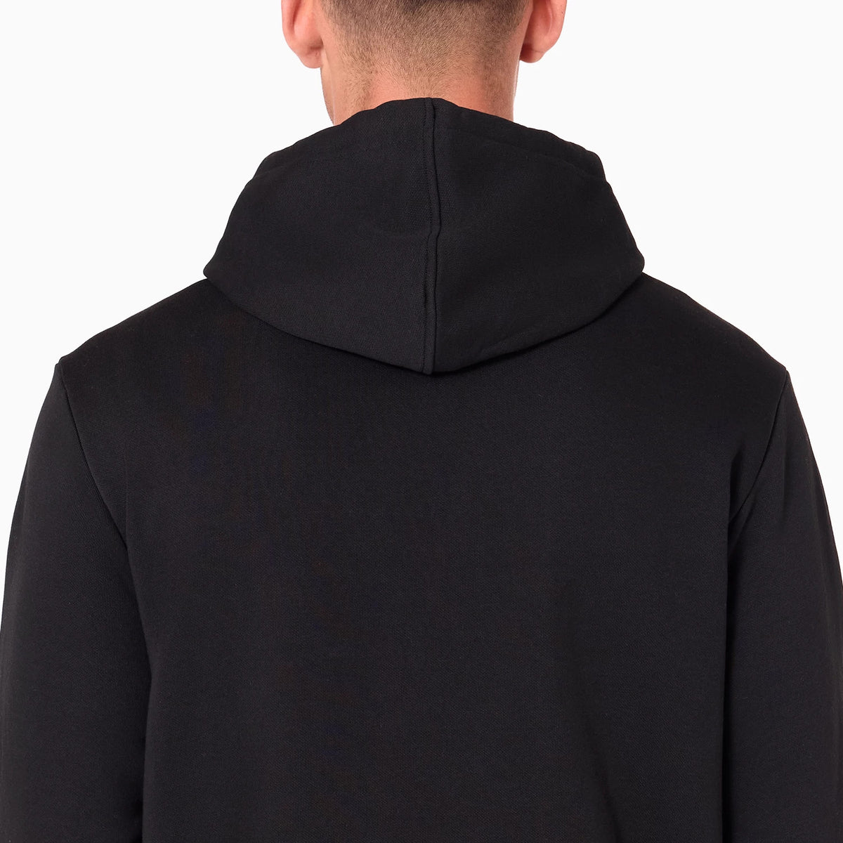 New Era Atlanta Hawks NBA Black Pullover Hoodie, rear view showing the plain black hood resting on the shoulders and the smooth stitching detail along the centre seam of the hood against the black fabric.