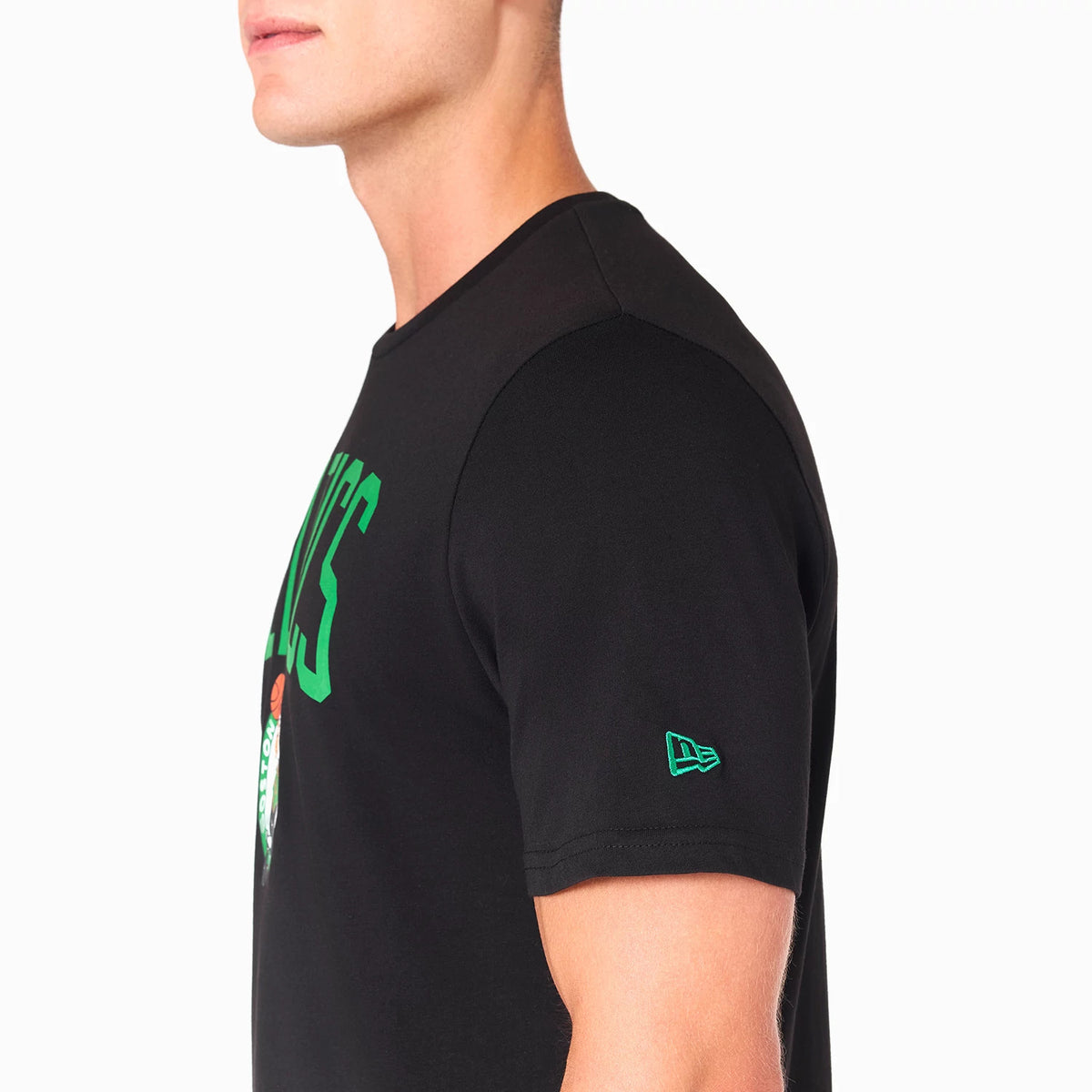 New Era Boston Celtics NBA Black T-Shirt, side view showing the black fabric with a green embossed New Era logo on the sleeve, a green Celtics print arching across the chest and a partial green and white Celtics logo below.