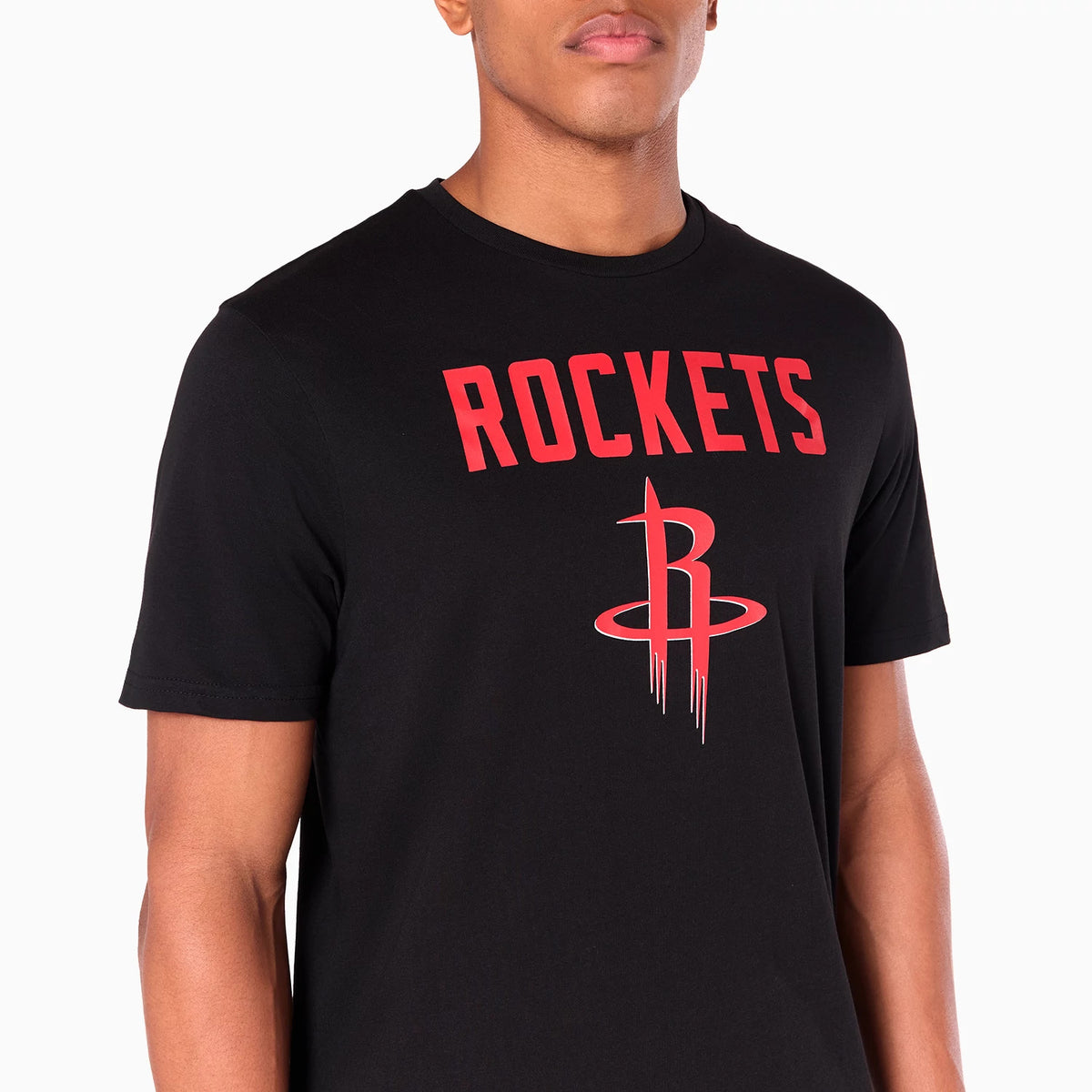 New Era Houston Rockets NBA Black T-Shirt, on-model view showing the black t-shirt with 'ROCKETS' printed in bold red letters across the chest, and a large Houston Rockets logo in red centred below.