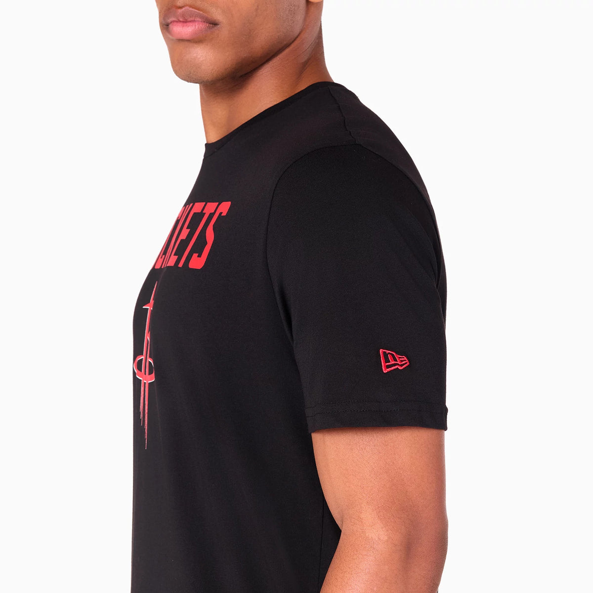 New Era Houston Rockets NBA Black T-Shirt, side view showing a black short-sleeved shirt with a red embossed New Era logo on the sleeve and the Rockets logo and text displayed vertically in red on the chest.