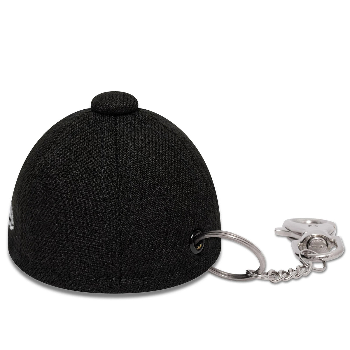 New Era New Era Mini Cap Black Key Chain, rear view showing the black structured crown with top button and side eyelet attaching a silver keyring and lobster clasp chain accessory.