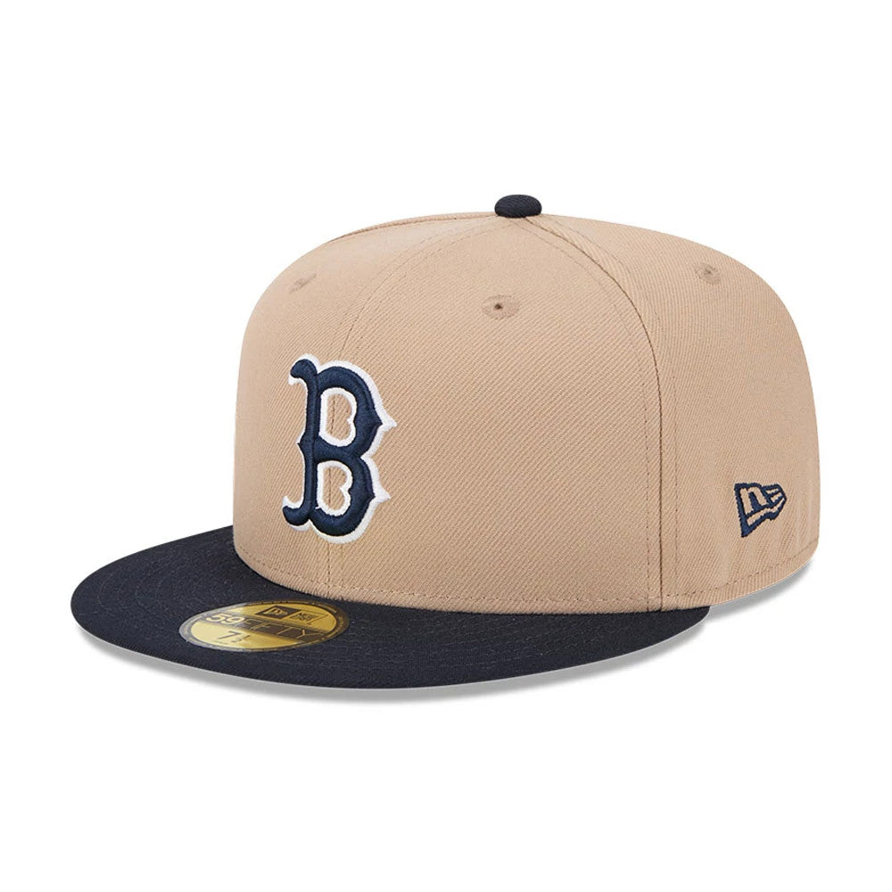 Boston Red Sox MLB Evergreen Light Beige New Era 59FIFTY Fitted Cap, three-quarter view with a navy embroidered B logo on the front panel, navy visor with a gold 59FIFTY size sticker, and a New Era flag logo on the left side.