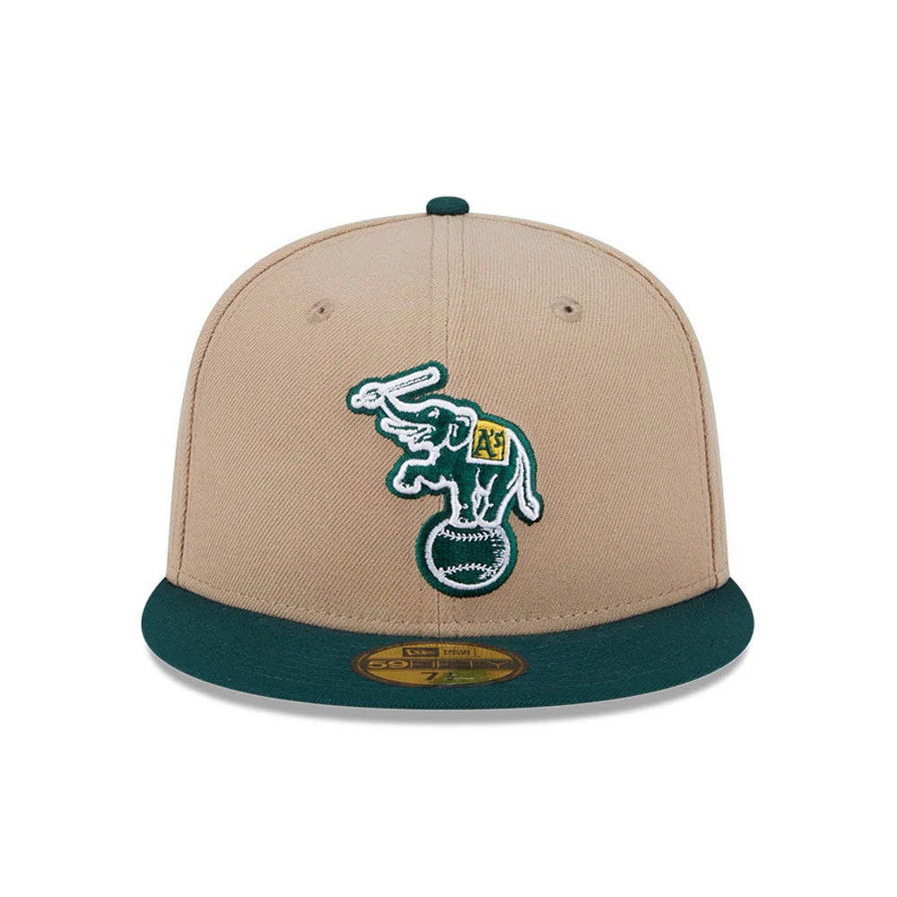 Athletics MLB Evergreen Light Beige New Era 59FIFTY Fitted Cap, front view with raised logo of an elephant atop a baseball on the light beige crown, dark green visor and gold 59FIFTY size sticker centred on the visor.