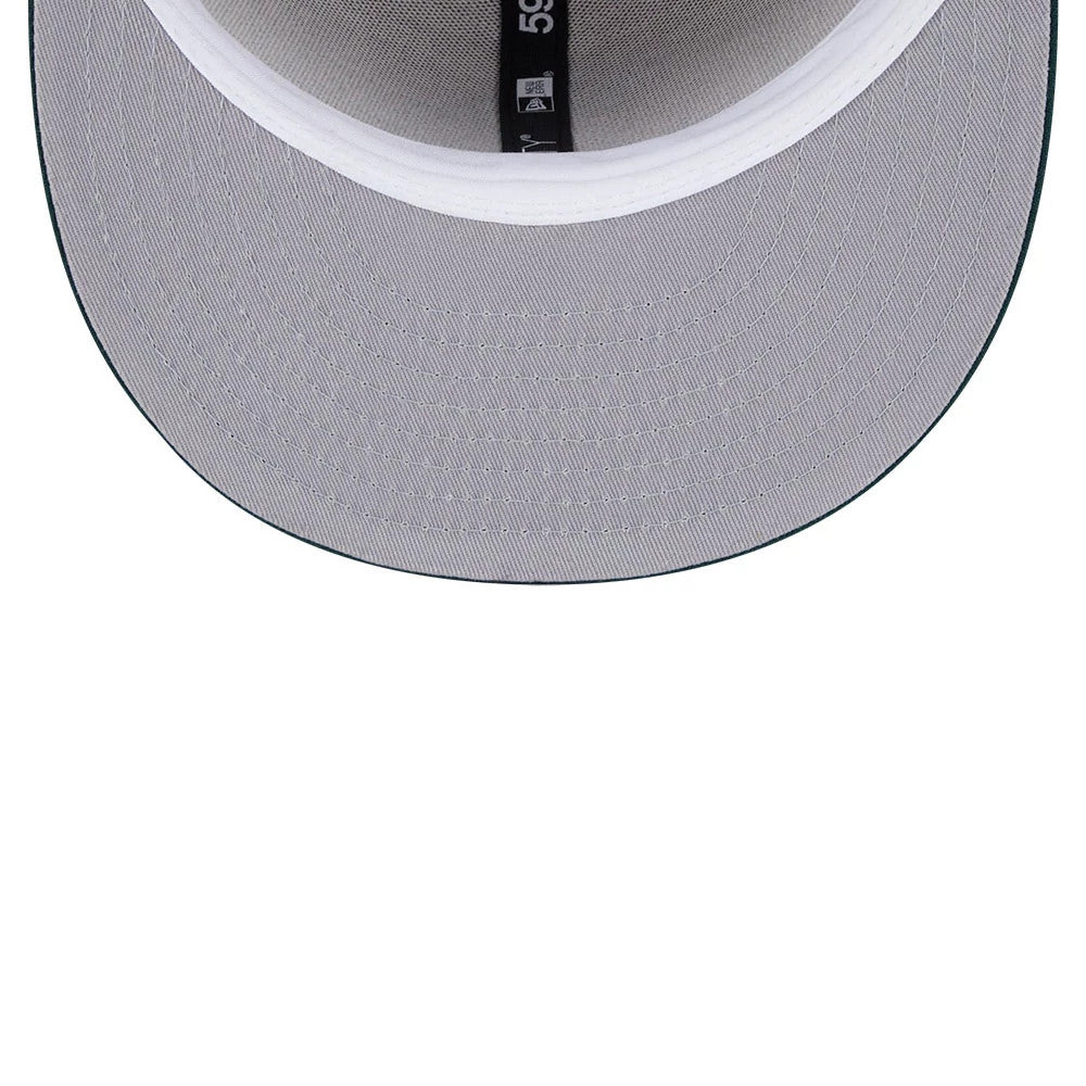 Athletics MLB Evergreen Light Beige New Era 59FIFTY Fitted Cap, inside view showing the grey undervisor, black sweatband with branding, and a tagged white taping along the seams of the structured crown.