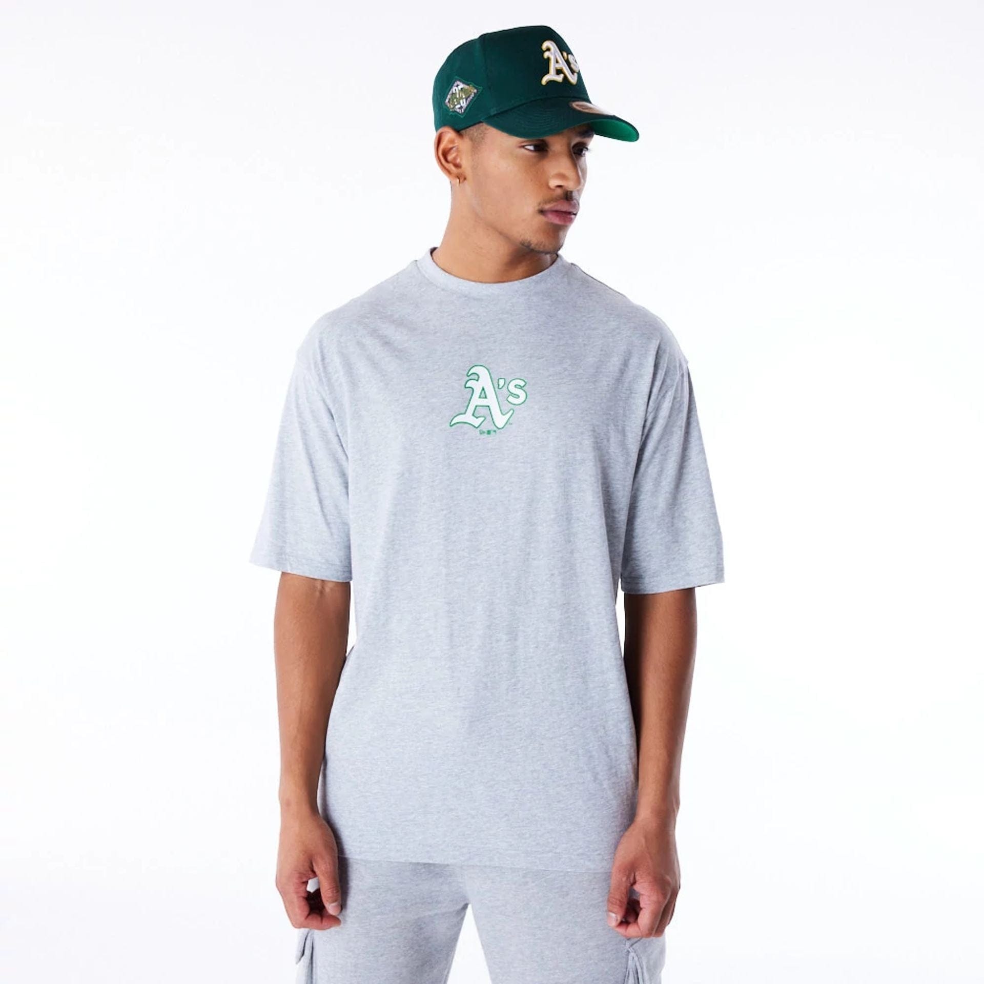 The Male model is wearing Oakland Athletics MLB World Series Grey Oversized T-Shirt 2
