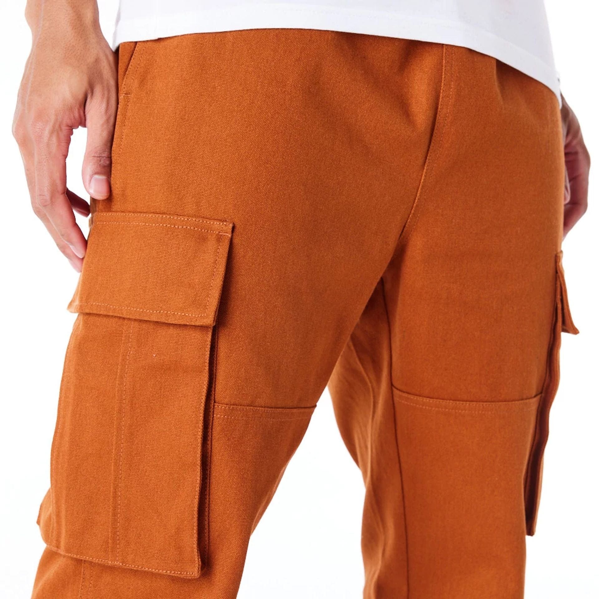 The Male model is wearing New Era Brown Cargo Trousers 2