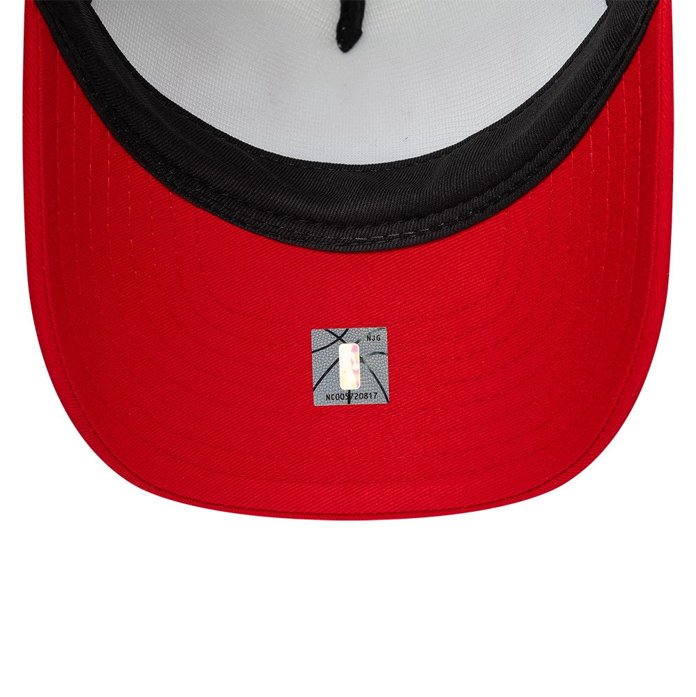 Chicago Bulls Youth NBA Retro Red New Era 9FORTY A-Frame Trucker Cap, inside view showing a grey sweatband, white taping, and a holographic NBA sticker on the underside of the red visor.