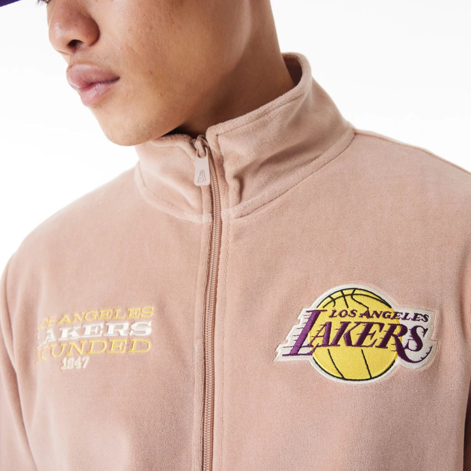 The Male model is wearing LA Lakers NBA Lifestyle Velour Beige Track Jacket 2