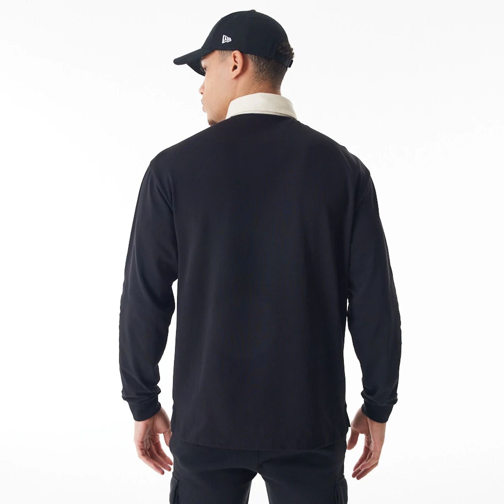 The Male model is wearing Chicago Bulls NBA Lifestyle Black Rugby Shirt 2