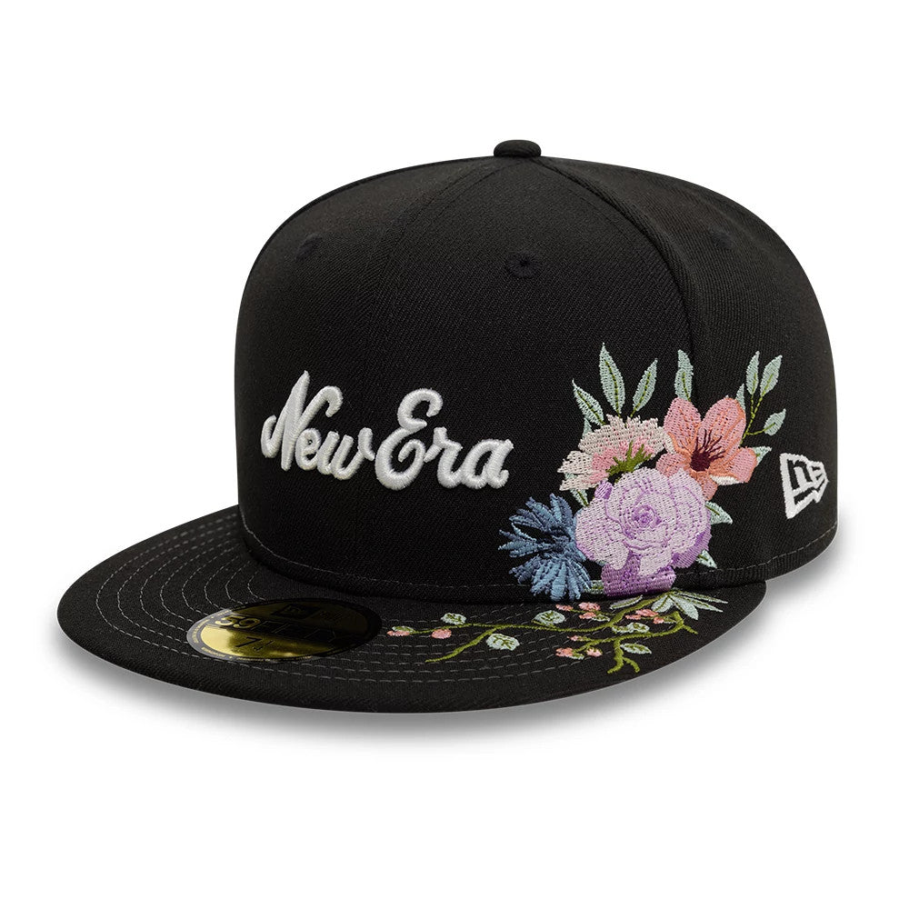 New Era Floral Emblem Black New Era 59FIFTY Fitted Cap, three-quarter view showing white New Era script logo on the front panel, floral embroidery on the right side, and gold 59FIFTY size sticker on the flat visor.