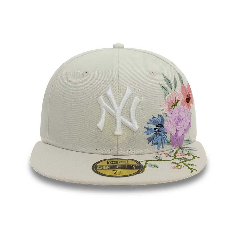 New York Yankees MLB Floral Light Beige New Era 59FIFTY Fitted Cap, front view showing raised white NY logo embroidery on the light beige crown with multicoloured floral embroidery on the right side and a gold 59FIFTY size sticker on the visor.