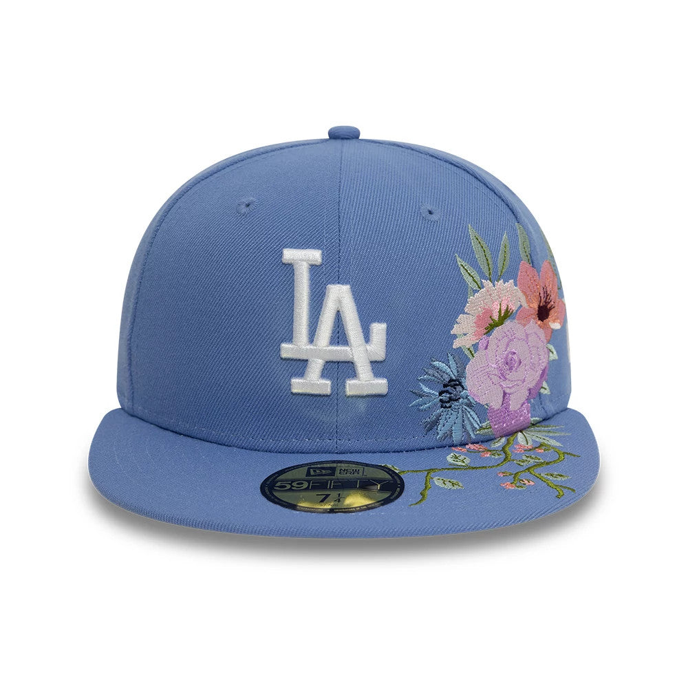 LA Dodgers MLB Floral Blue New Era 59FIFTY Fitted Cap, front view showing a white embroidered LA logo on the front panel with colourful floral embroidery on the right, complemented by a gold 59FIFTY size sticker on the visor.