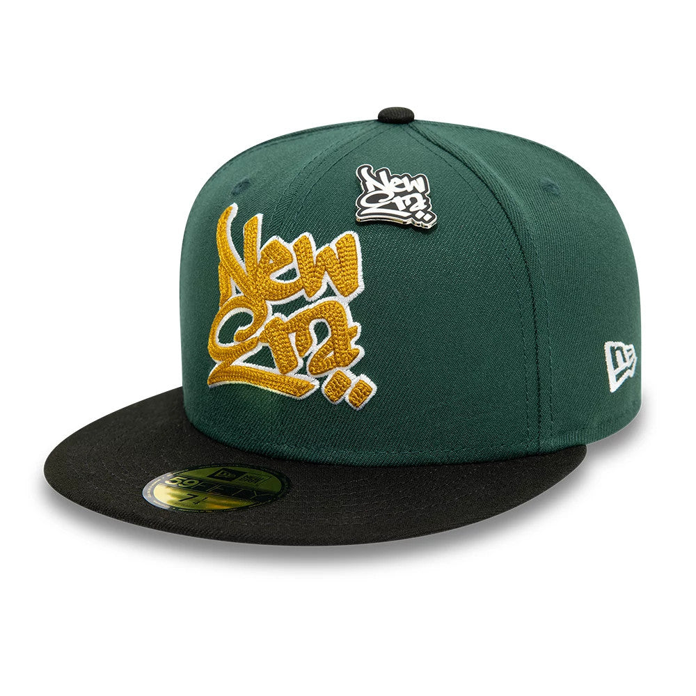 This is a New Era Front Script 59FIFTY Fitted Cap in dark green & black. 1