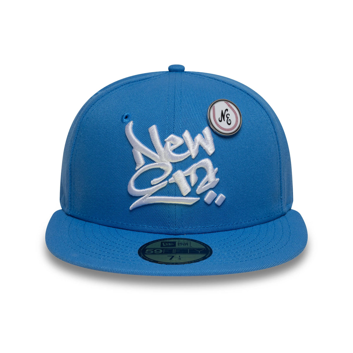 New Era Oversized Script Blue New Era 59FIFTY Fitted Cap, front view with prominent white embroidered script logo on the front panel, a pin badge on the upper right, and a gold 59FIFTY size sticker on the flat blue visor.