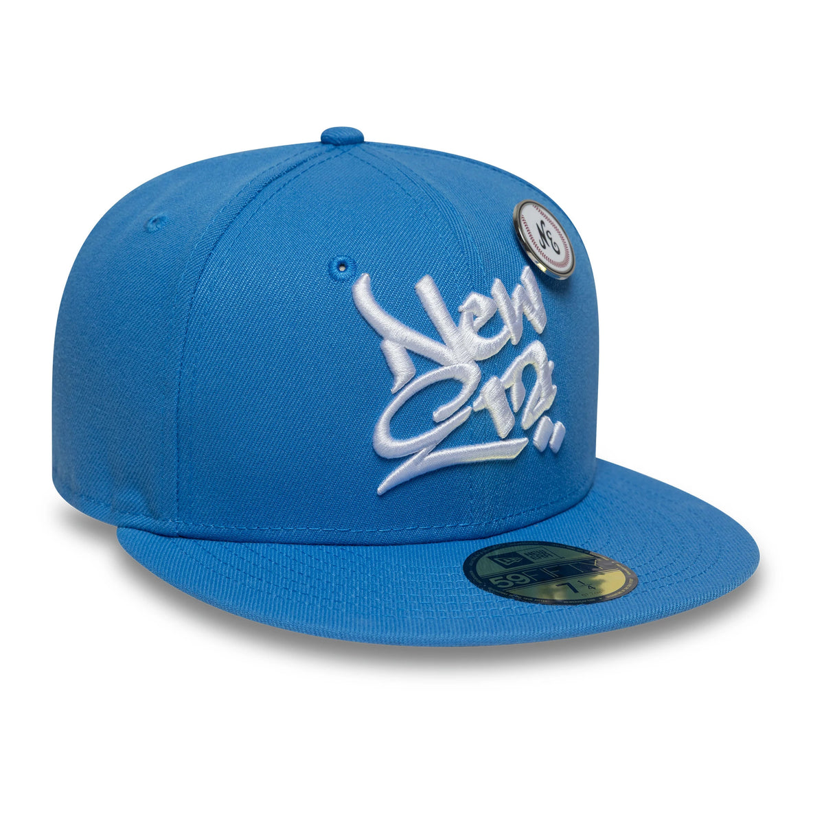 New Era Oversized Script Blue New Era 59FIFTY Fitted Cap, three-quarter view showing raised white script embroidery on the front panel, blue flat visor with gold 59FIFTY size sticker, and top button and eyelet detail on the structured crown.