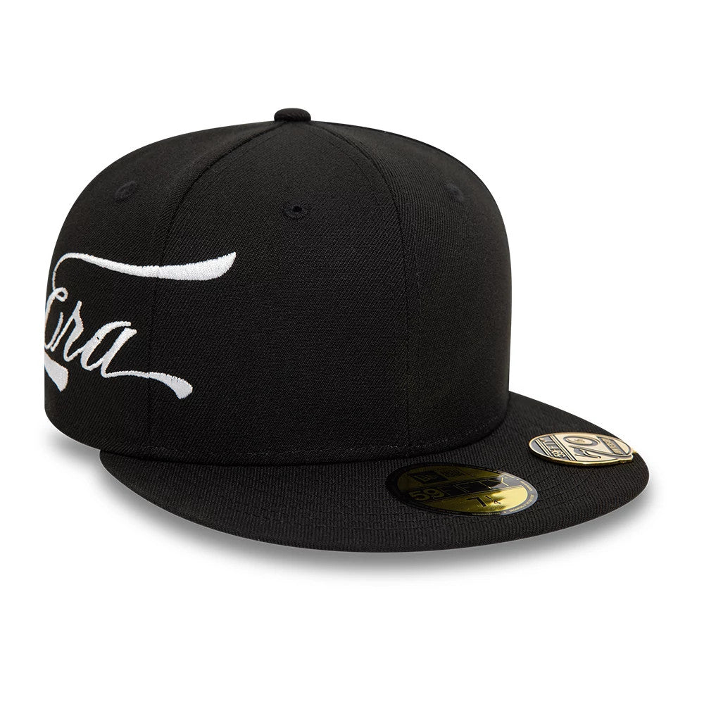 New Era Side Script Black 59FIFTY Fitted Cap, three-quarter view showing white script embroidery on the left side, a flat black visor with a gold 59FIFTY size sticker, and a structured black crown with eyelets.