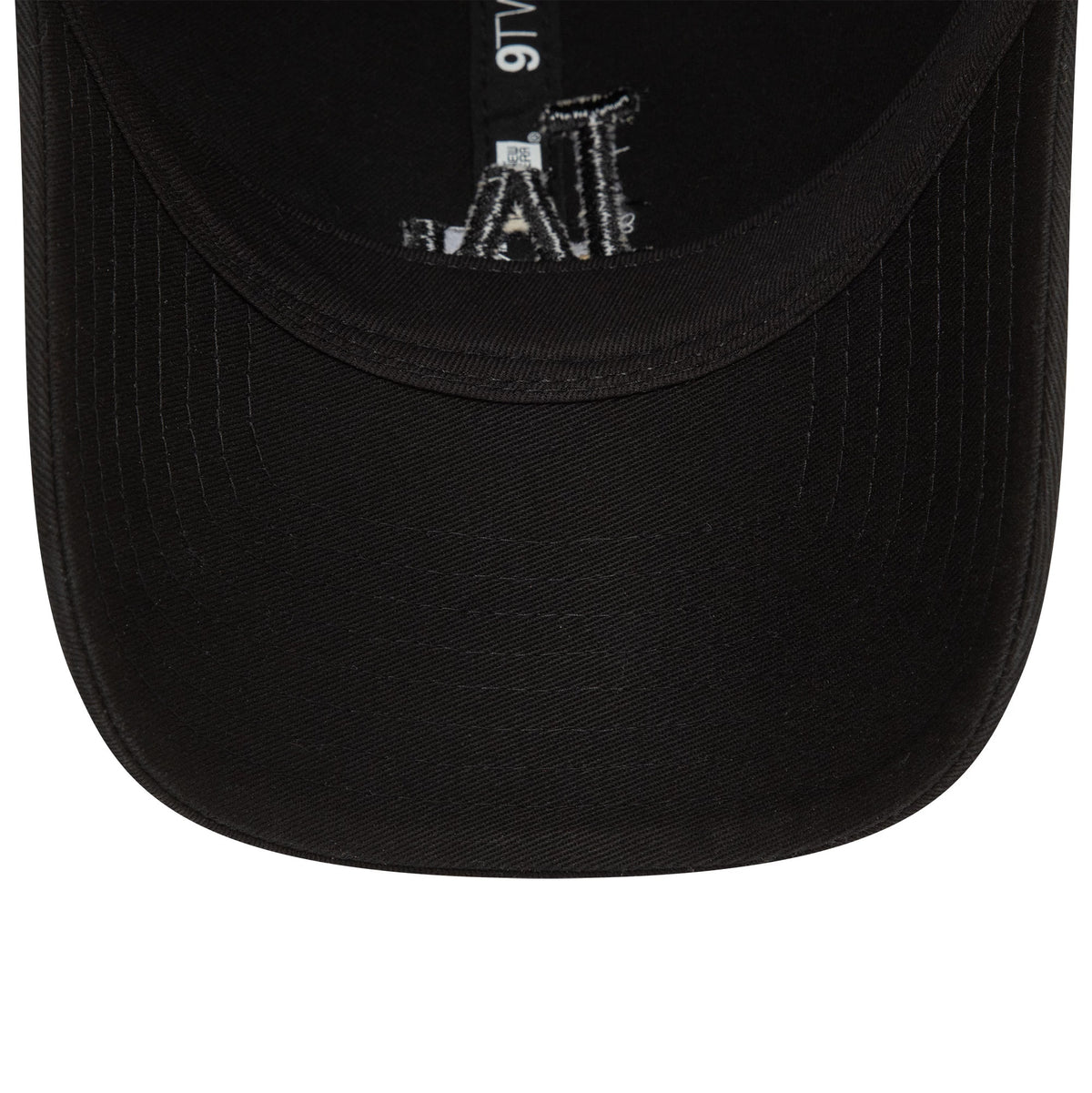 LA Dodgers Washed Black New Era 9TWENTY Adjustable Cap, inside view with black undervisor, showing a 9TWENTY size sticker on the dark taping and white LA embroidery details under the crown.