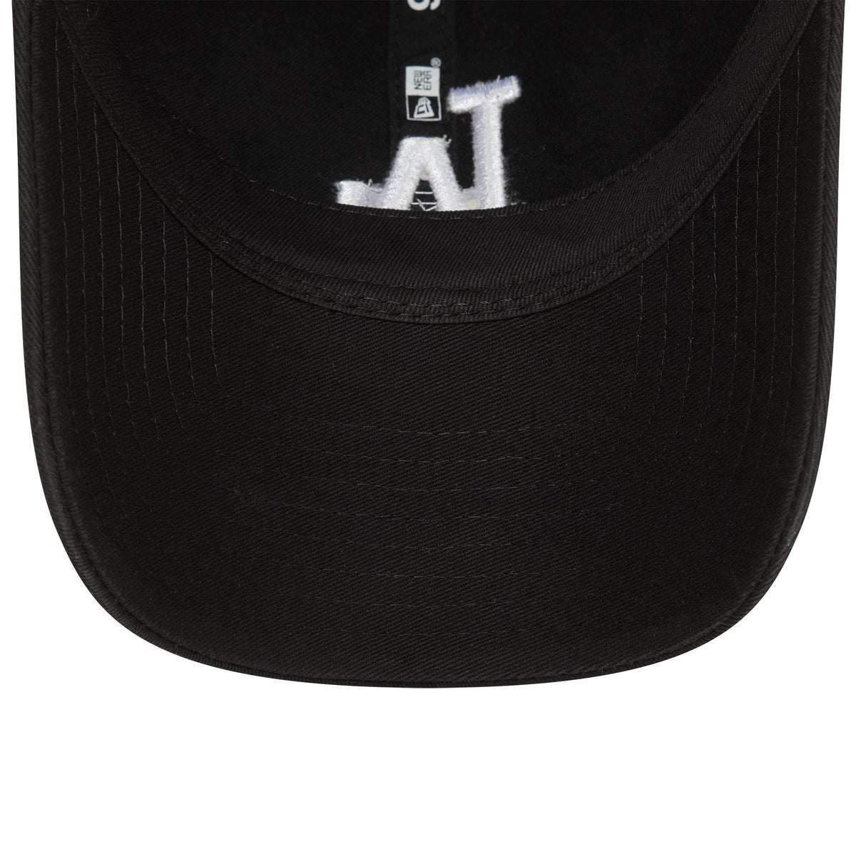 LA Dodgers Washed Black New Era 9TWENTY Adjustable Cap, inside view showing black taping along the seams, a white embroidered LA logo on the underside of the visor, and a sizing label near the cap band.