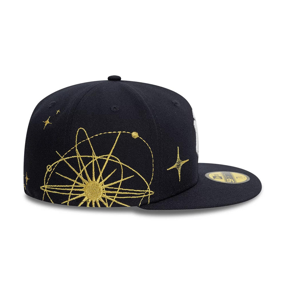 New York Yankees MLB Zodiac Navy New Era 59FIFTY Fitted Cap, side view with intricate gold embroidered zodiac design on the crown, navy flat visor featuring the gold 59FIFTY size sticker on top.