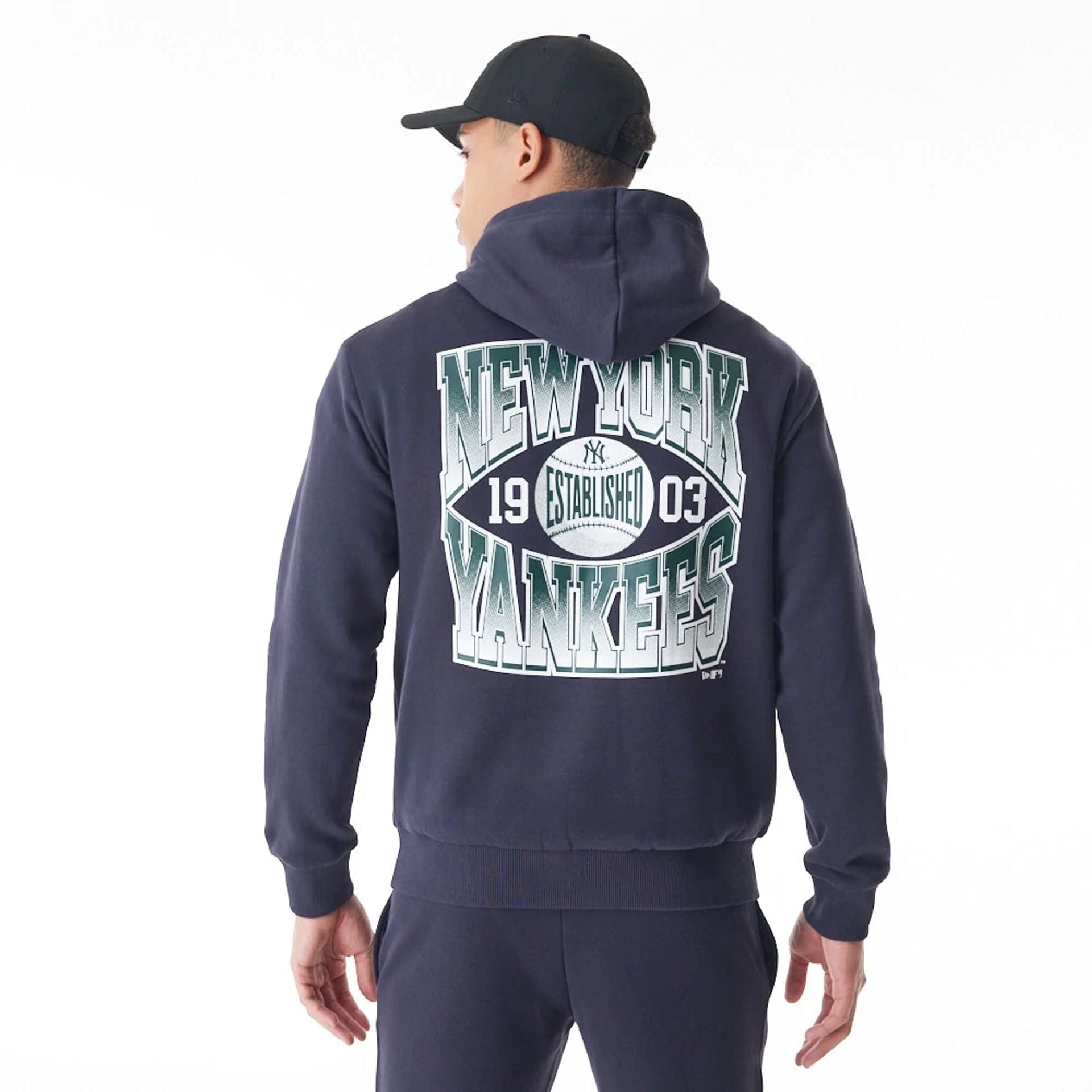 The Male model is wearing New York Yankees MLB Gradient Navy Oversized Pullover Hoodie 2