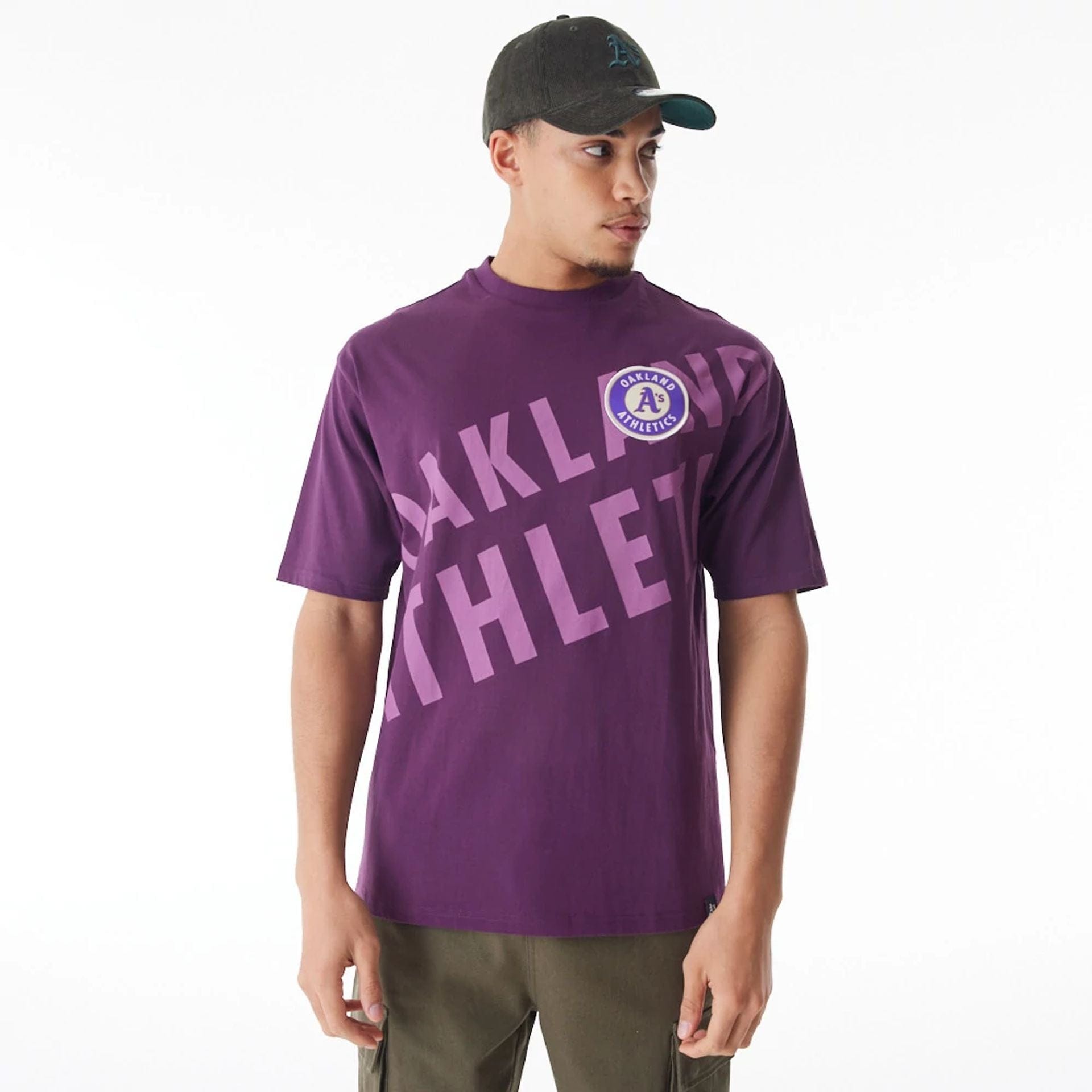 The Male model is wearing Oakland Athletics MLB Script Graphic Dark Purple Oversized T-Shirt 1