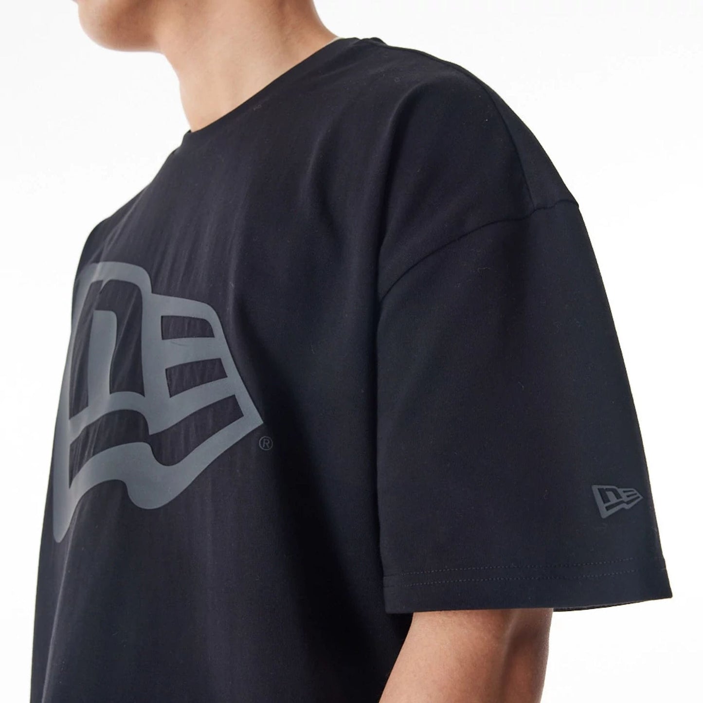 The Male model is wearing New Era Flag Black Oversized T-Shirt 5