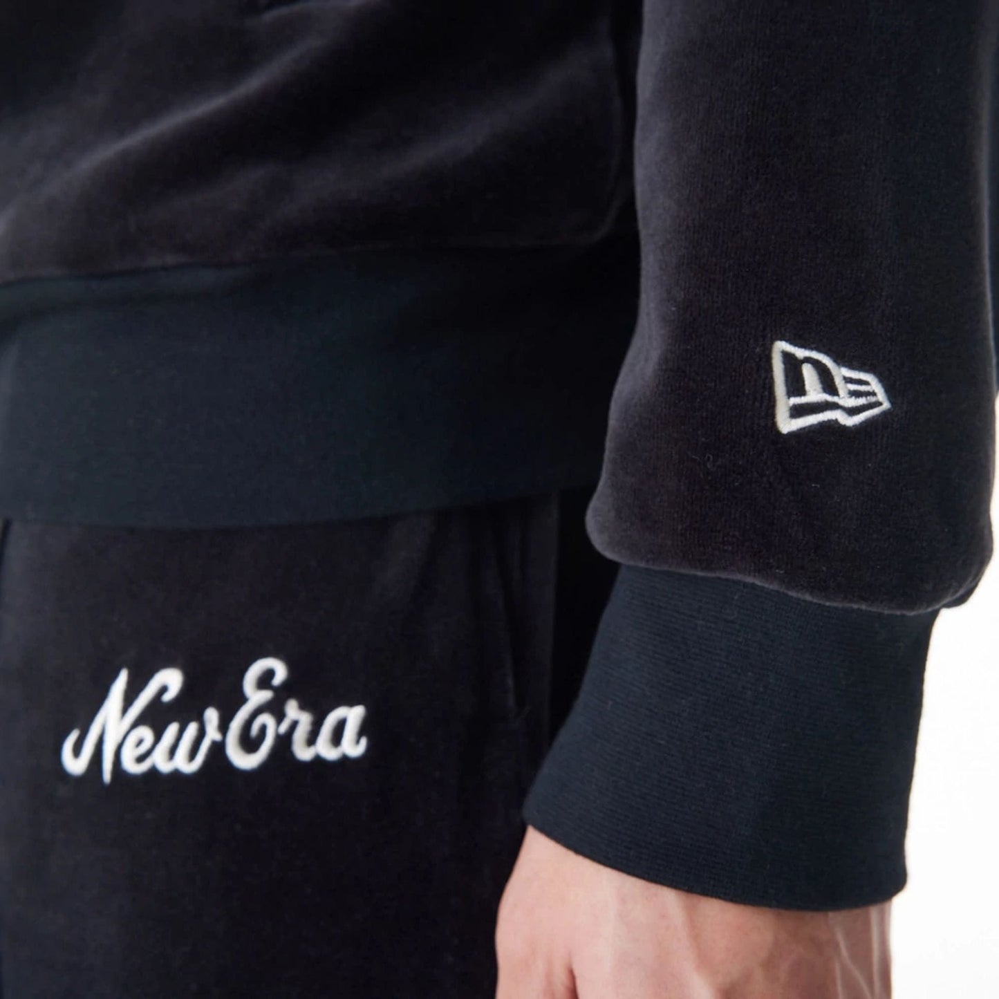 The Male model is wearing New Era Velour Black Track Jacket 12