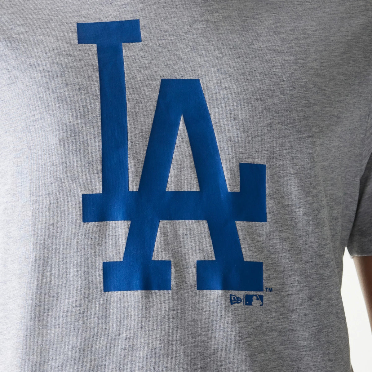 New Era LA Dodgers MLB Regular Grey T-Shirt, front view featuring a large blue LA logo printed prominently in the centre of the grey fabric with the New Era and MLB logos printed small beneath the right side of the letters.