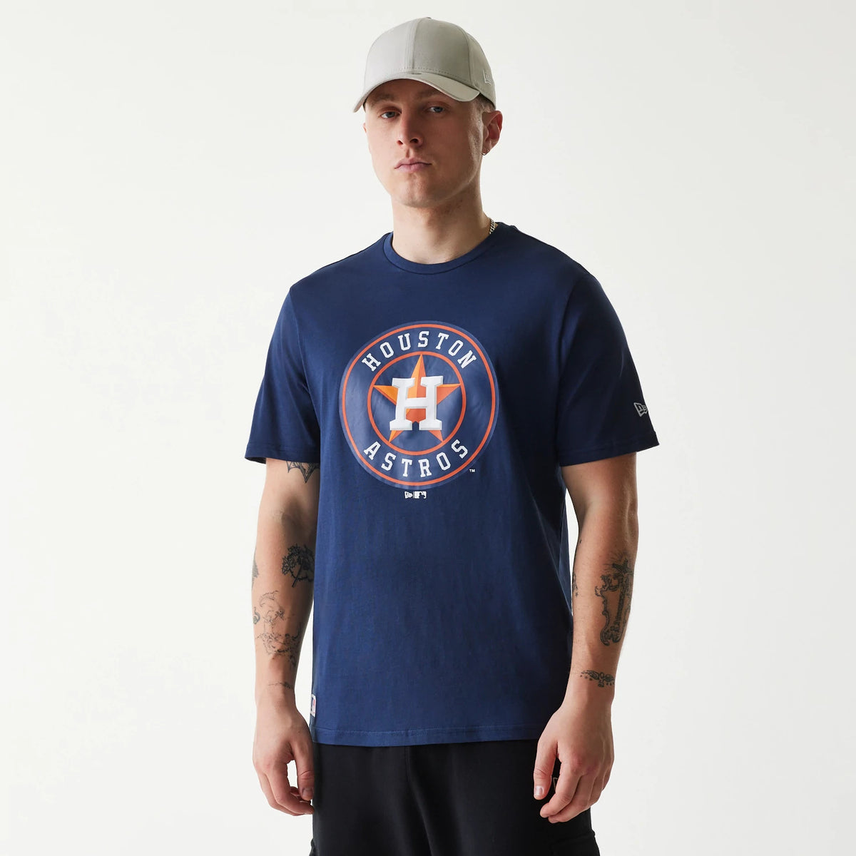 New Era Houston Astros MLB Regular Dark Blue T-Shirt, on-model view showing the large printed logo on the chest, featuring the team emblem and text in orange and white, with a small debossed New Era logo on the left sleeve.