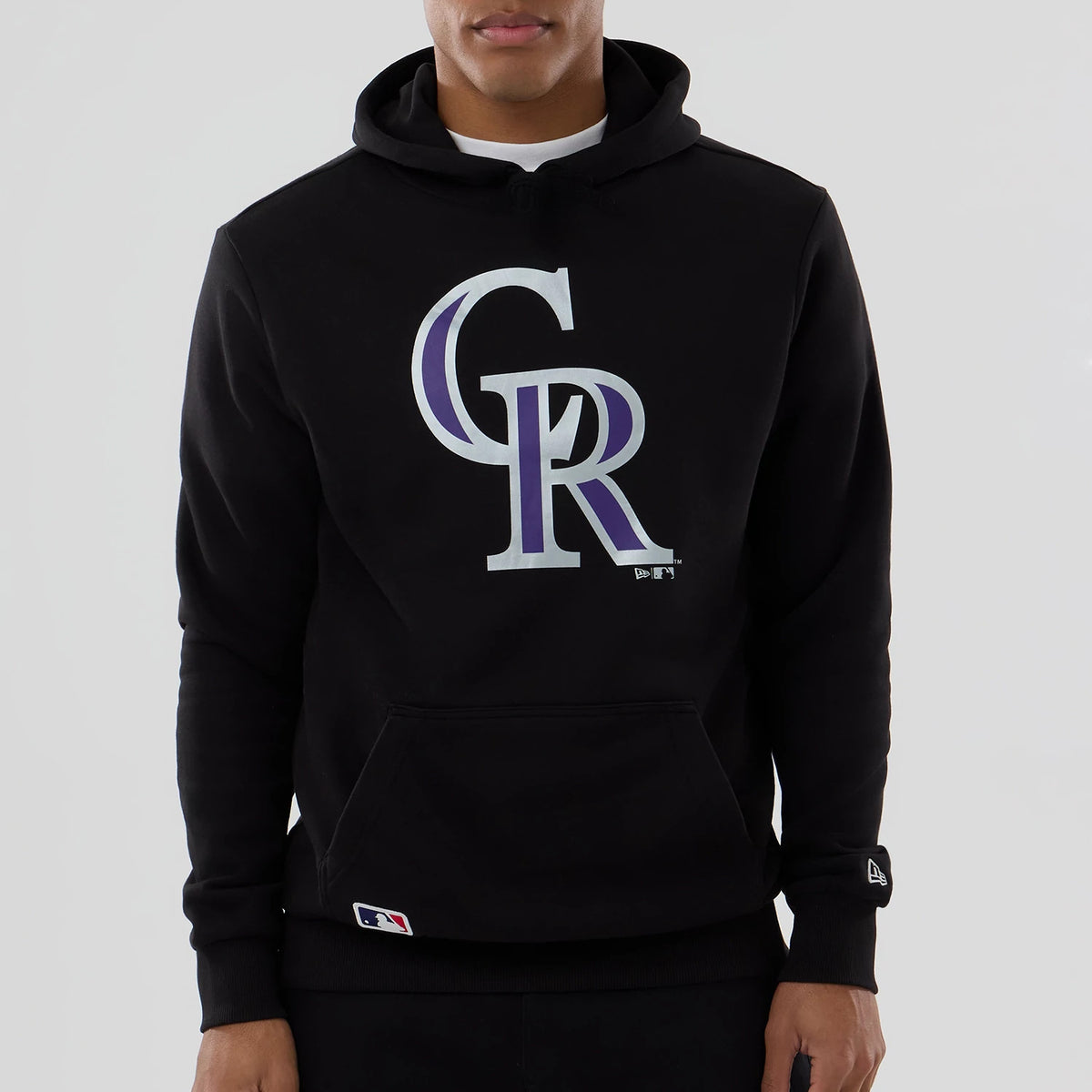 New Era Colorado Rockies MLB Black Pullover Hoodie, front view featuring a large purple and white CR logo centred on the chest, a front pouch pocket, and a small New Era logo on the left sleeve above the cuff.