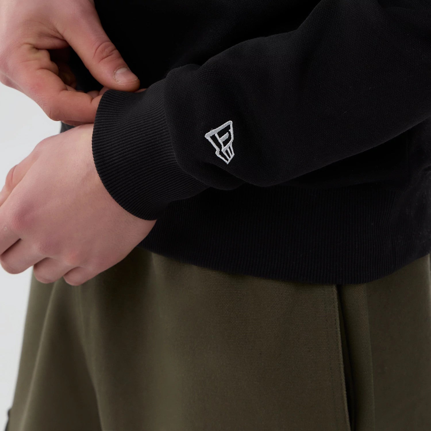 The Male model is wearing Las Vegas Raiders NFL Core Black Crew Neck Sweater 4