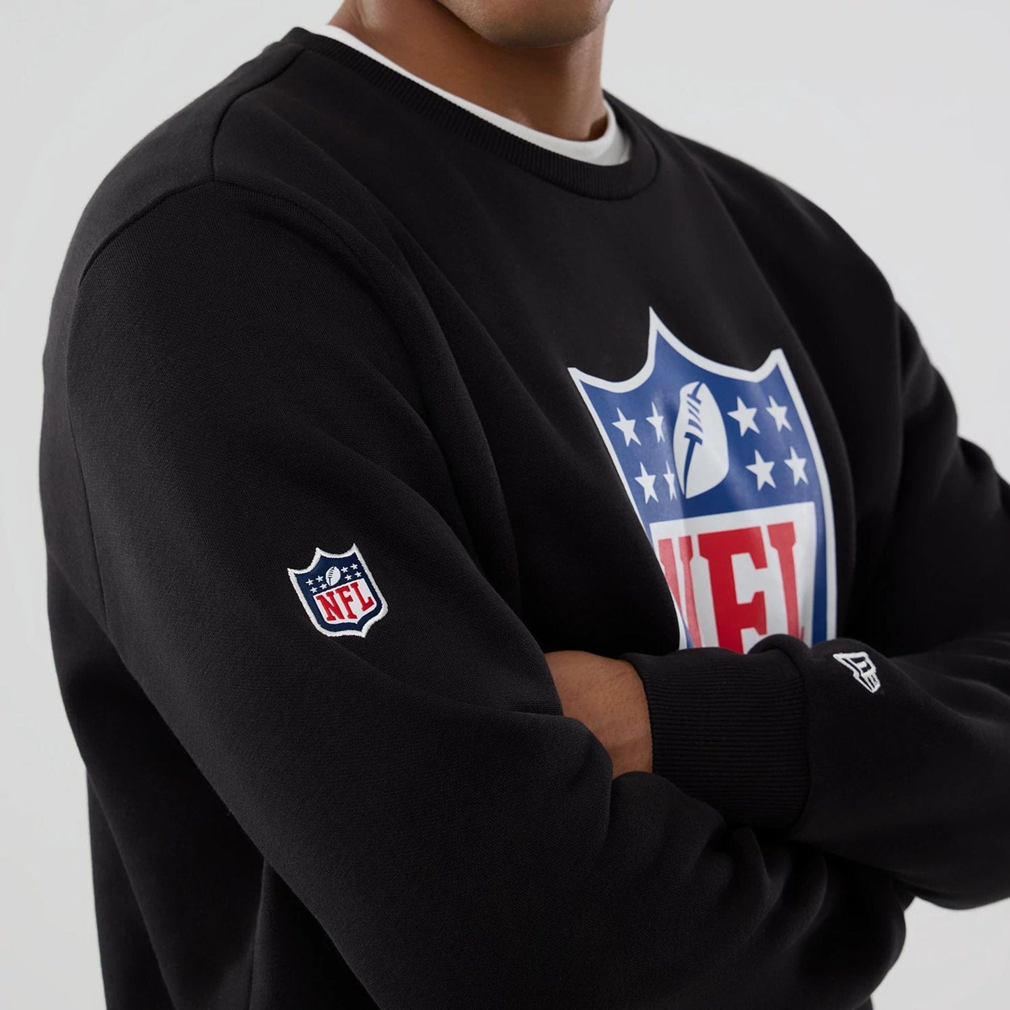 The Male model is wearing NFL Generic Logo Black Crew Neck Sweater 7