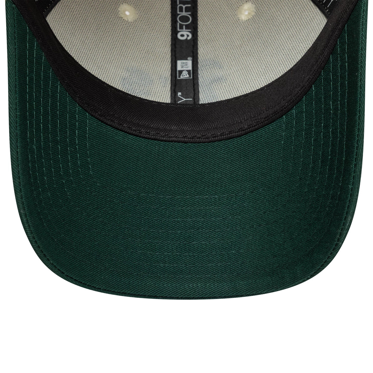 Athletics Colour Block Cream New Era 9FORTY Adjustable Cap, inside view showing black taping running through the centre of the cream sweatband, with a 9FORTY size sticker on the green undervisor.