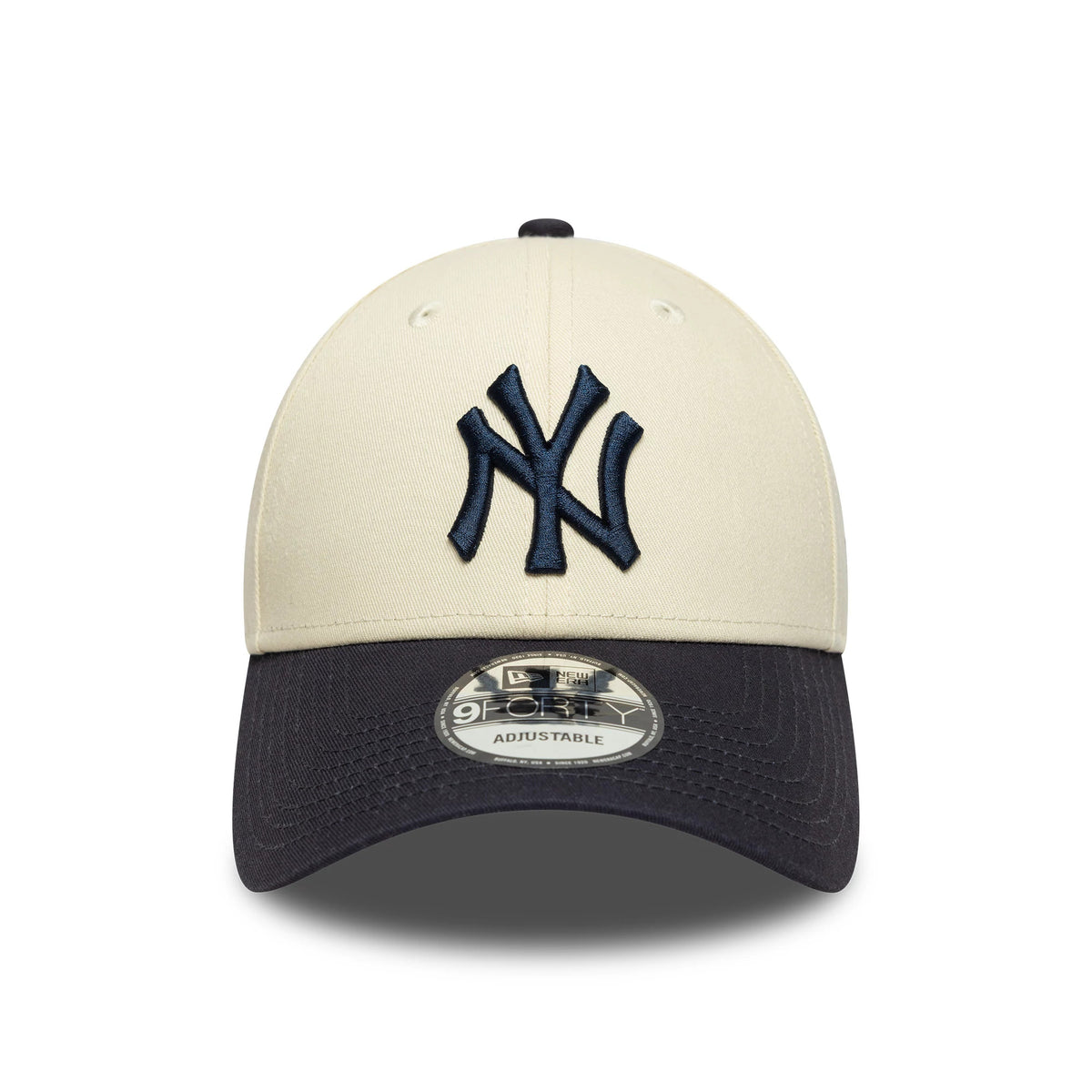 New York Yankees Colour Block Cream New Era 9FORTY Adjustable Cap, front view showing the raised navy NY logo on the cream front panels, contrasted with a dark visor and centred 9FORTY size sticker.
