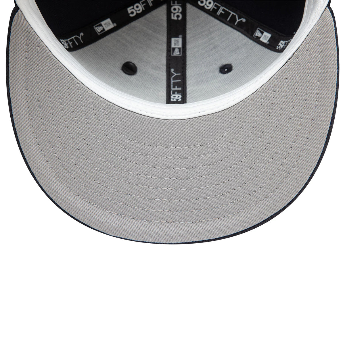 New Era Graphic Navy New Era 59FIFTY Fitted Cap, inside view showing the light grey undervisor, black taping with white 59FIFTY and New Era logos, and a dark sweatband around the interior edge.