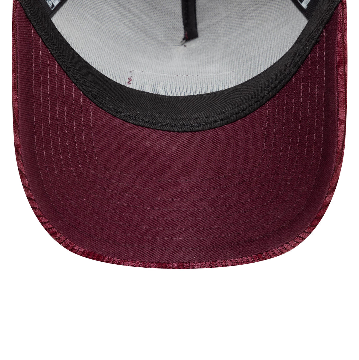 Red Bull Racing Cord Open Red New Era 9FORTY A-Frame Trucker Adjustable Cap, inside view showing the grey sweatband, black taping along the seams, and burgundy undervisor of the structured interior.