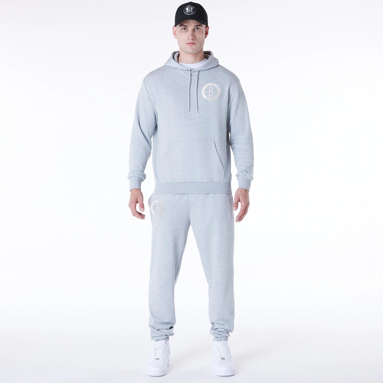The Male model is wearing Brooklyn Nets NBA League Essential Grey Oversized Pullover Hoodie 3
