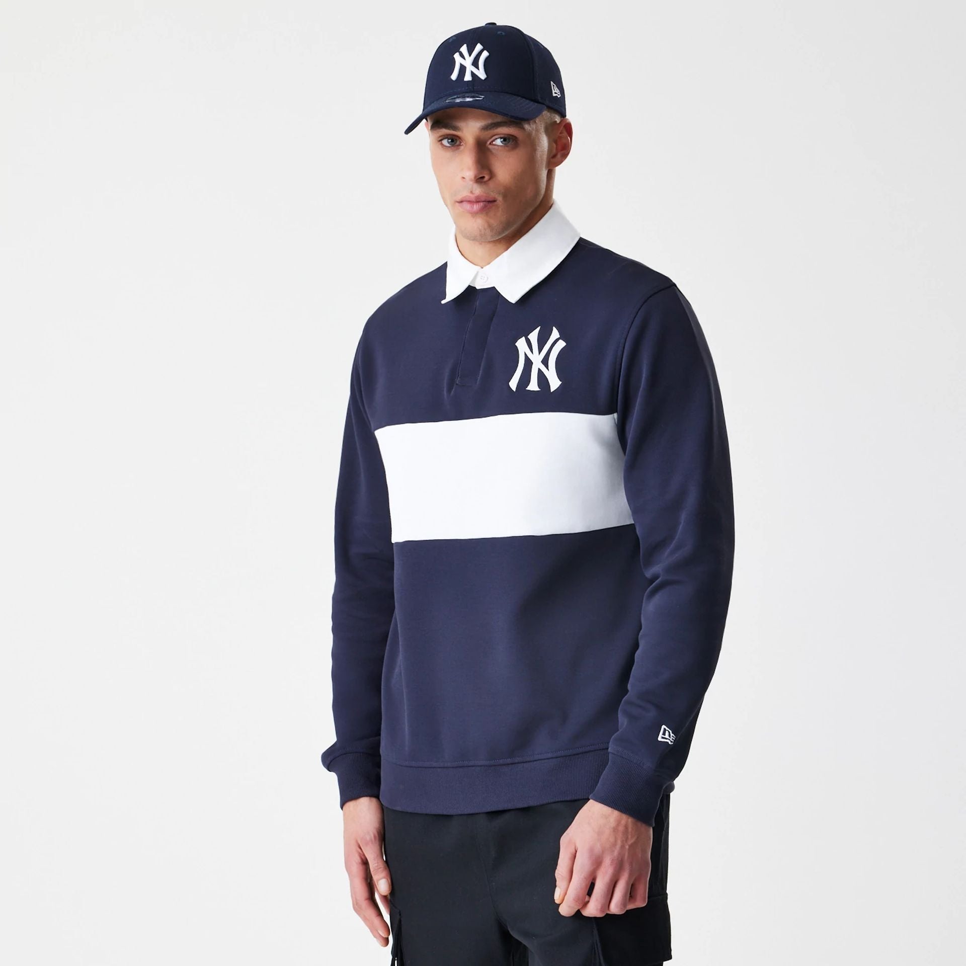 The Male model is wearing New York Yankees Throwback Prep Navy Long Sleeve Rugby Shirt 1