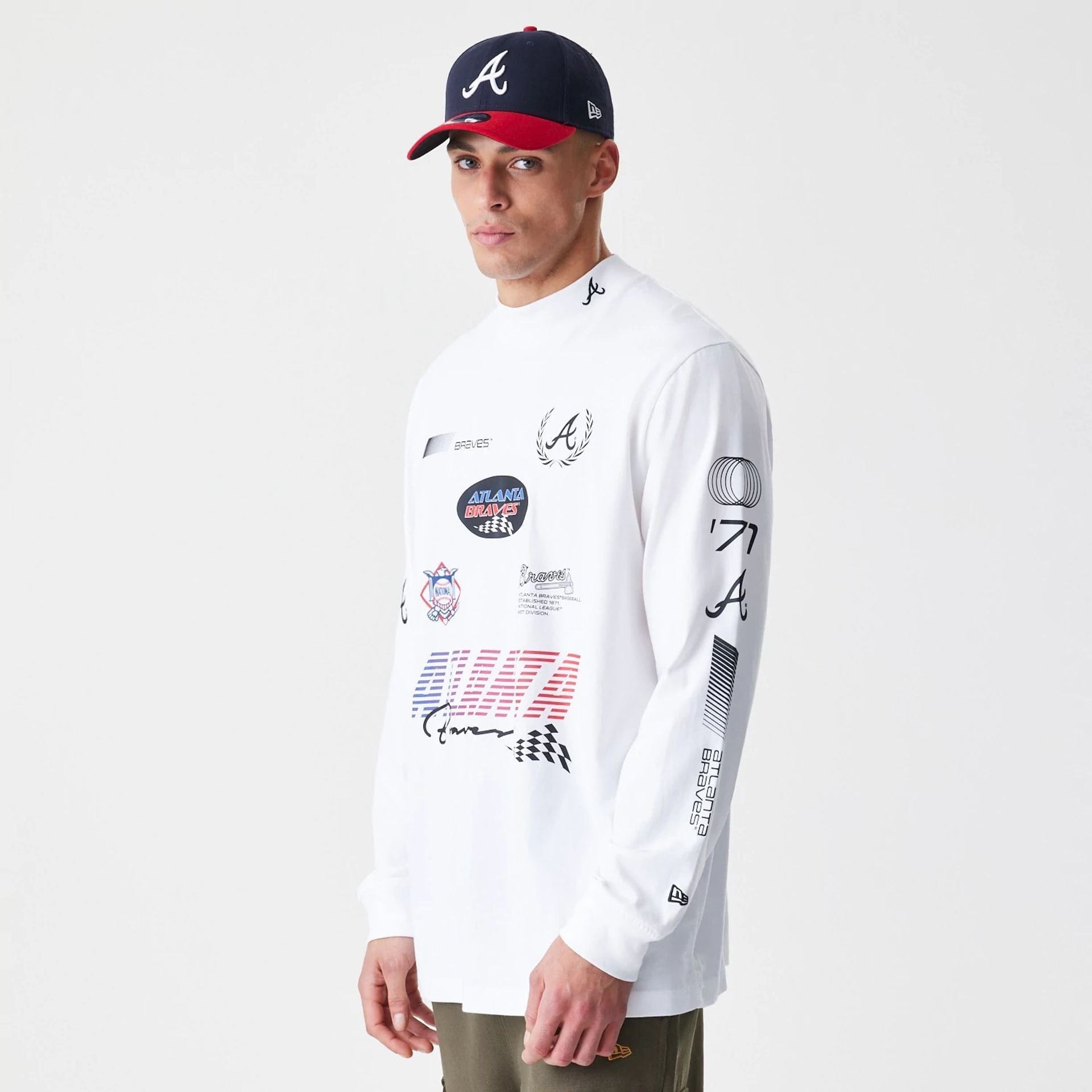 The Male model is wearing Atlanta Braves Modern Driver White Long Sleeve T-Shirt 1