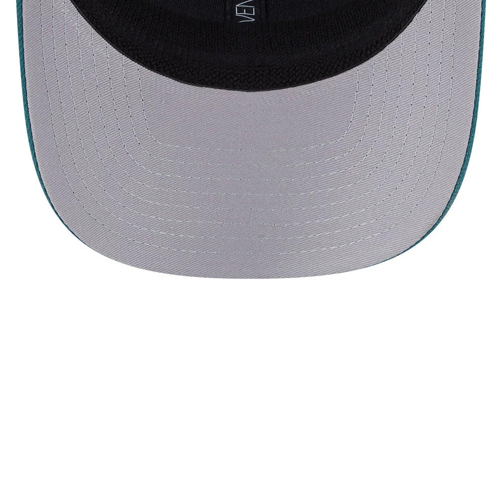 Philadelphia Eagles NFL Evergreen Dark Green New Era 9SEVENTY Stretch Snap Cap, inside view showing the black sweatband and grey undervisor with a New Era branded taping detail along the inner seams.