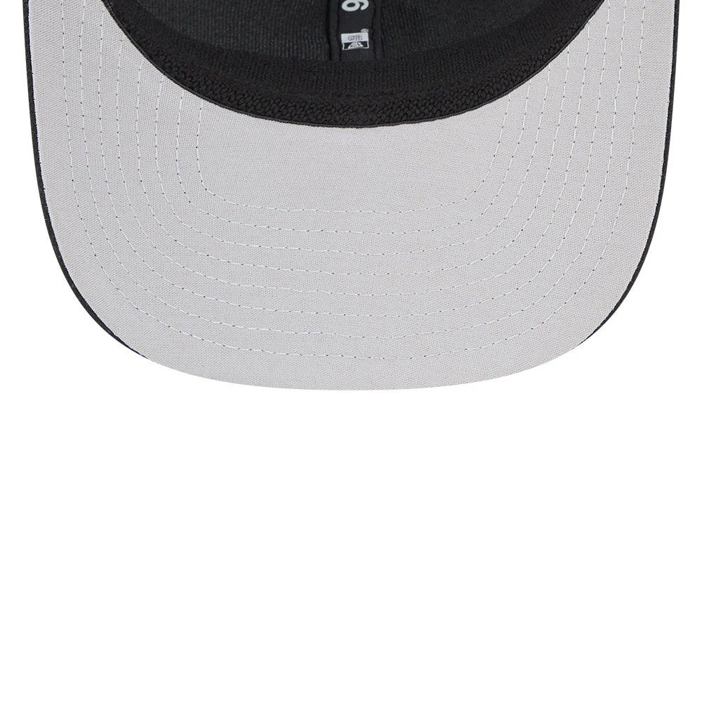 Colorado Rockies MLB Evergreen Black New Era 9SEVENTY Stretch Snap Adjustable Cap, inside view showing the black sweatband and team logo label on the grey undervisor, with contrasting white stitching details.